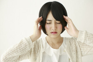 体調不良の女性